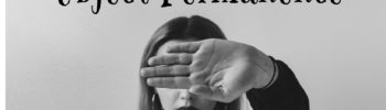 A woman with her hand blocking her vision.